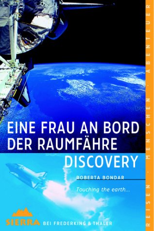 Eine Frau an Bord der Raumfähre Discovery. Touching the earth